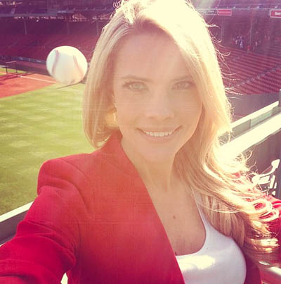 Reporter almost hit by baseball at Fenway Park while taking photo.